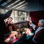 Fred (Scrooge's nephew) his wife and their friends toasting over a Christmas meal, A Christmas Carol