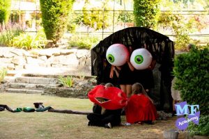 Magic Floor Academy students creating a monster with giant eyes and lips