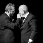 Lucky Eric and Les laughing and tapping on each others shoulders, Bouncers