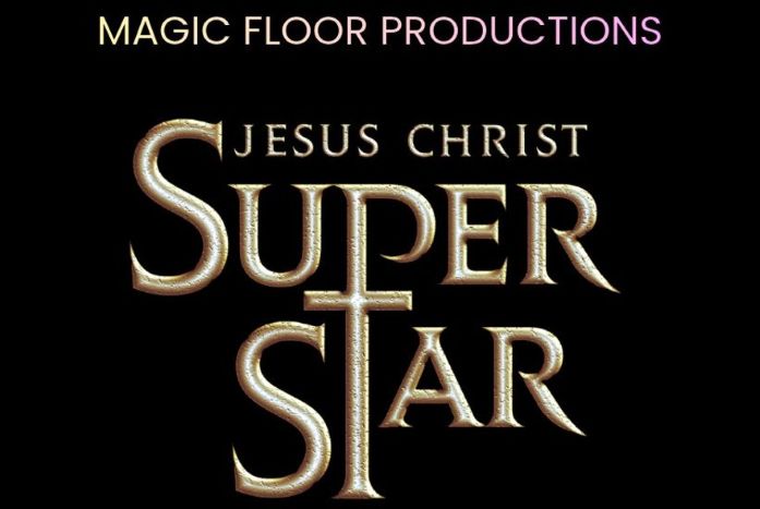 The ghost of Christmas Yet to Come stood in a graveyard surrounded by smoke pointing at Scrooge, A Christmas Carol